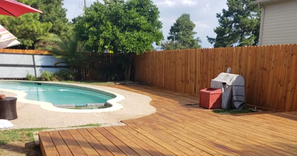 fence and deck staining houston - professional poolside deck and fence staining project results