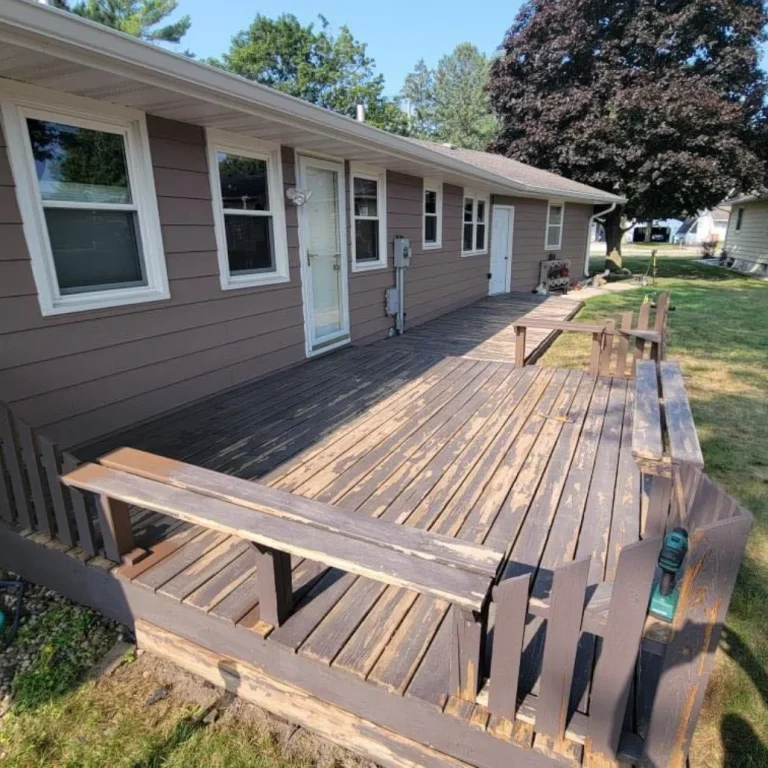 Deck staining before and after Houston showing half weathered gray wood half dark brown stained planks residential transformation in progress comparison visual