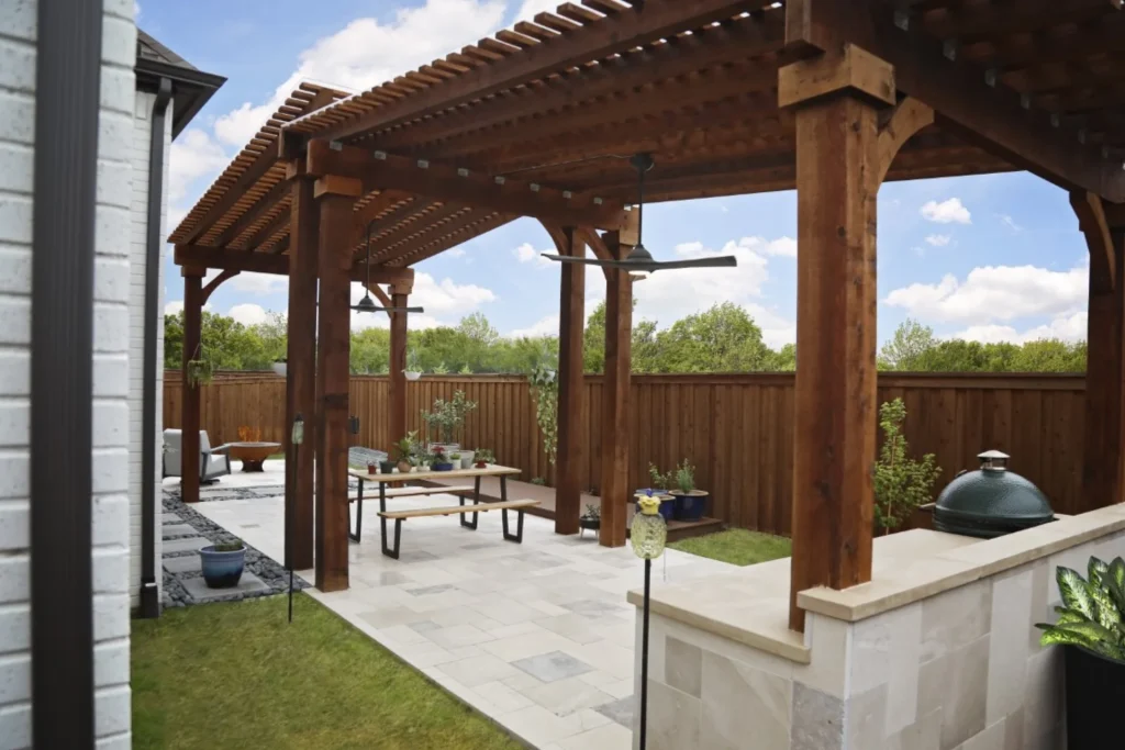Pergola Staining 8 Professional pergola staining with premium cedar brown stain on overhead beams and posts protecting luxury outdoor living space