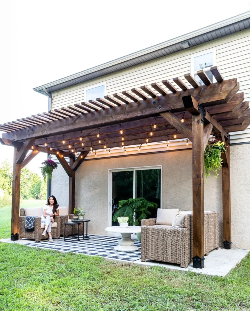 Pergola Staining 36 Professional pergola staining with rich walnut brown stain on attached pergola showing expert application without overspray on home siding