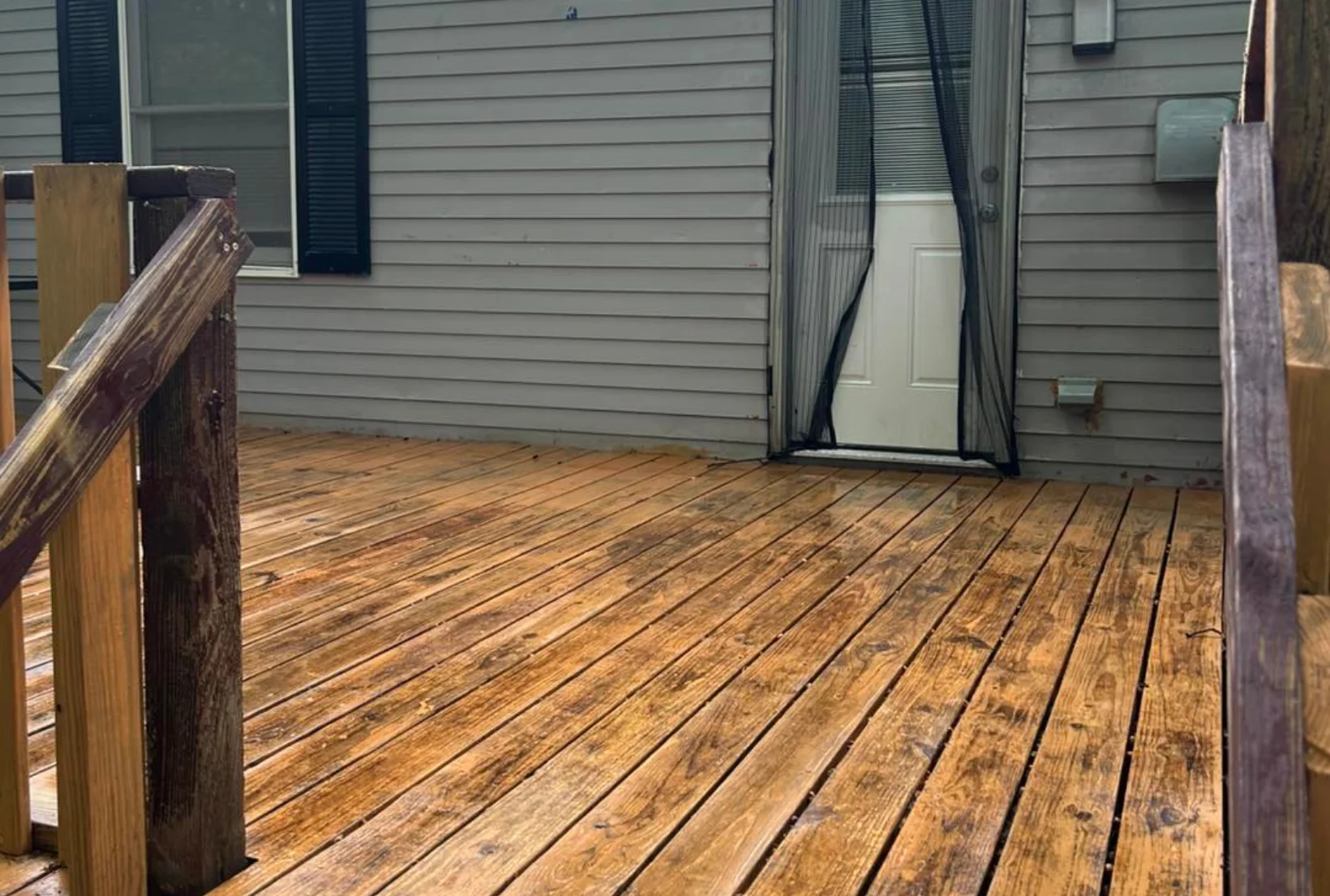 deck-cleaning-after-mildew-removal-houston Clean deck boards with mildew and dark stains removed after professional deck cleaning and prep service