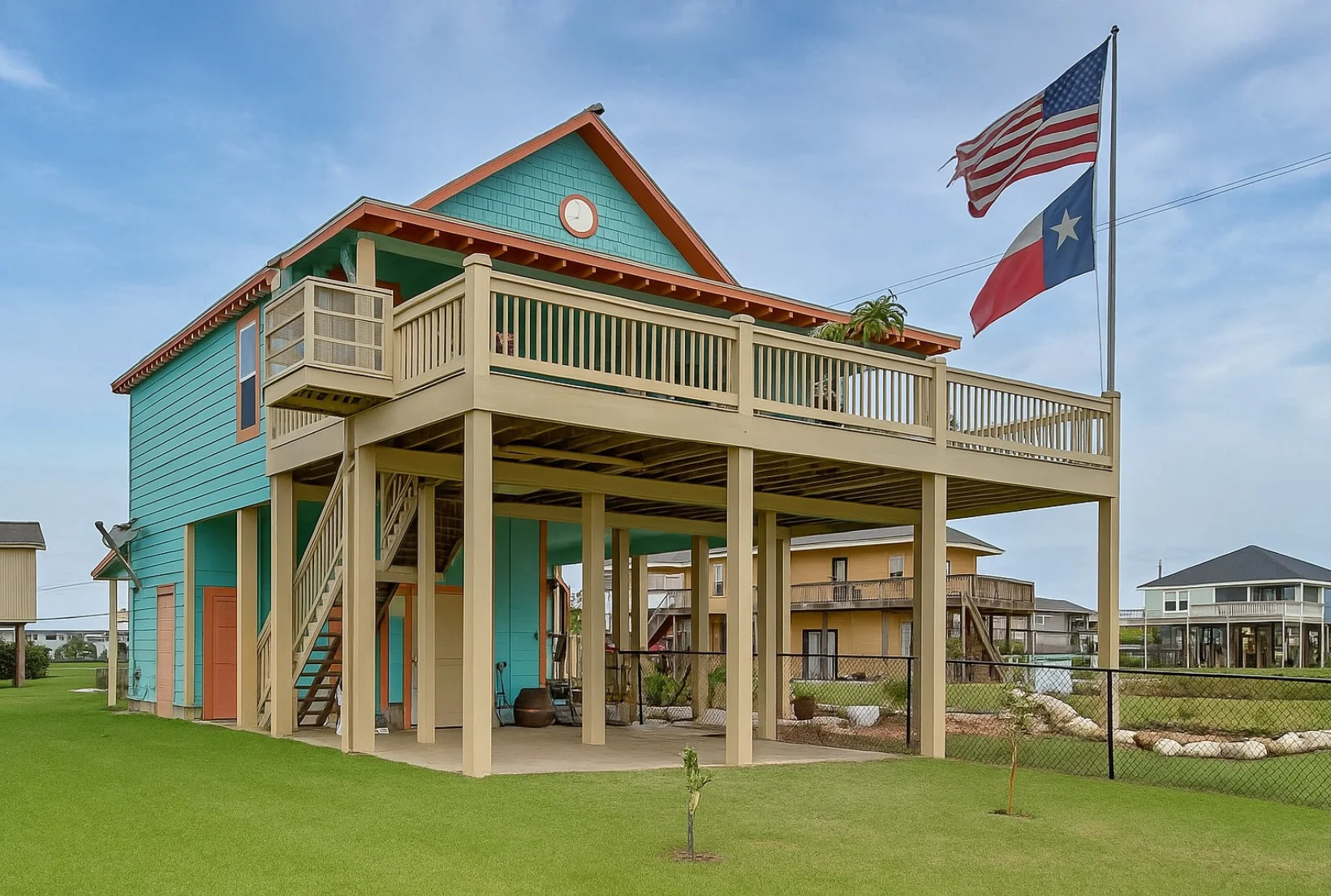 deck-staining-after-restoration-texas-beach-house Freshly stained cream-colored deck posts and railings on elevated Texas beach house after professional deck staining service